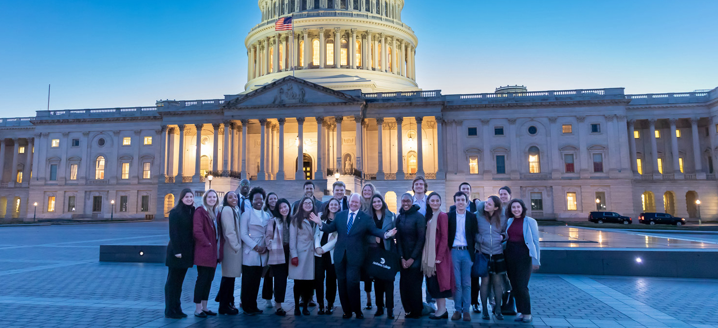 group of Amherst students pose in front of the Capitol building in Washington DC