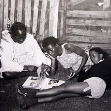 Makhoo, Nombuso and Thuli are looking at the album - Pamela Zungu