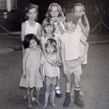 A group of the neighbor children standing in the street - René Jansen Van Vuuren