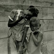 Boy and girl against wall, New Orleans, Louisiana