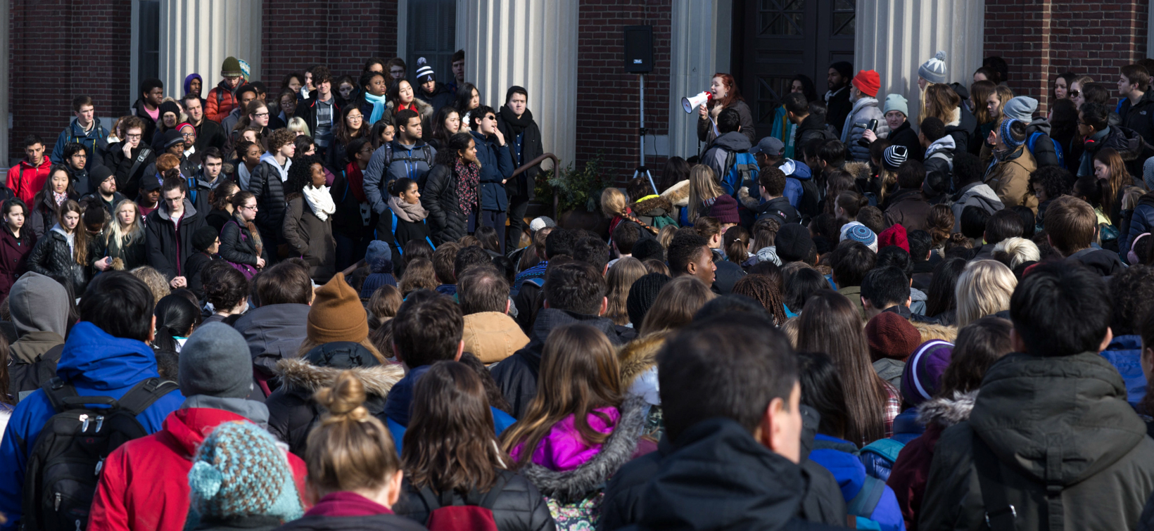 Students rally on the steps of Converse Hall