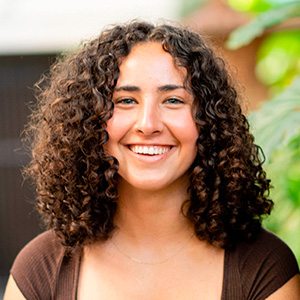 A young woman with curly hair