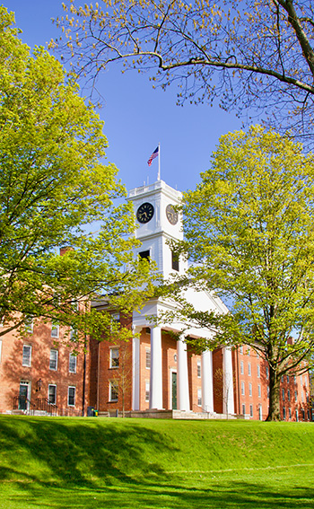 A photo of Johnson Chapel in spring surrounded by blossoming trees