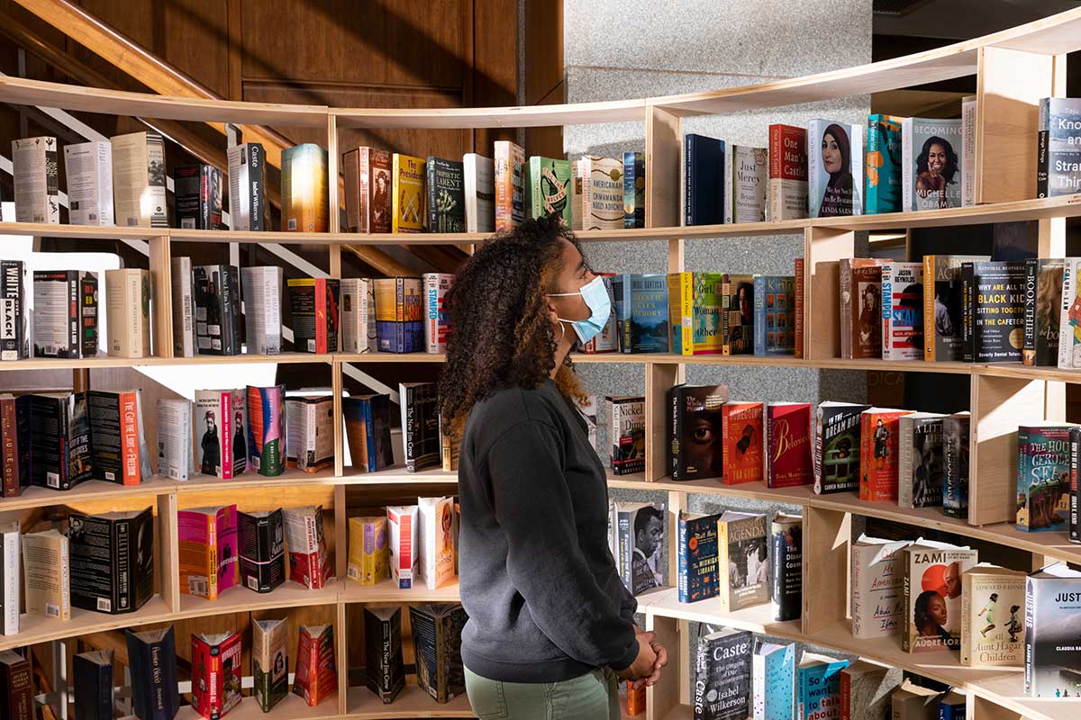 A woman examines the solidarity book exhibit