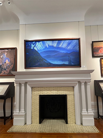 A painting above a fireplace