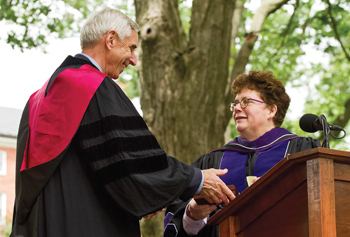Kent W. Faerber '63 receives the Medal for Eminent Service from Biddy Martin.