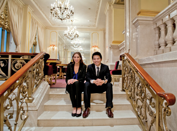 Lacie Goldberg ’13 and Henry Bao-Viet Nguyen ’13 seated on hotel staircase