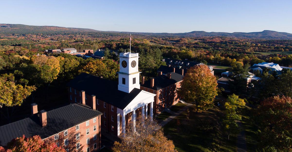 aerial view of Johnson Chapel and other campus buildings with mountain range in distance