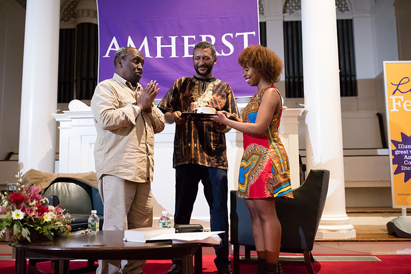 Ngugu wa Thiong'o receives a surprise birthday cake from two Amherst College students