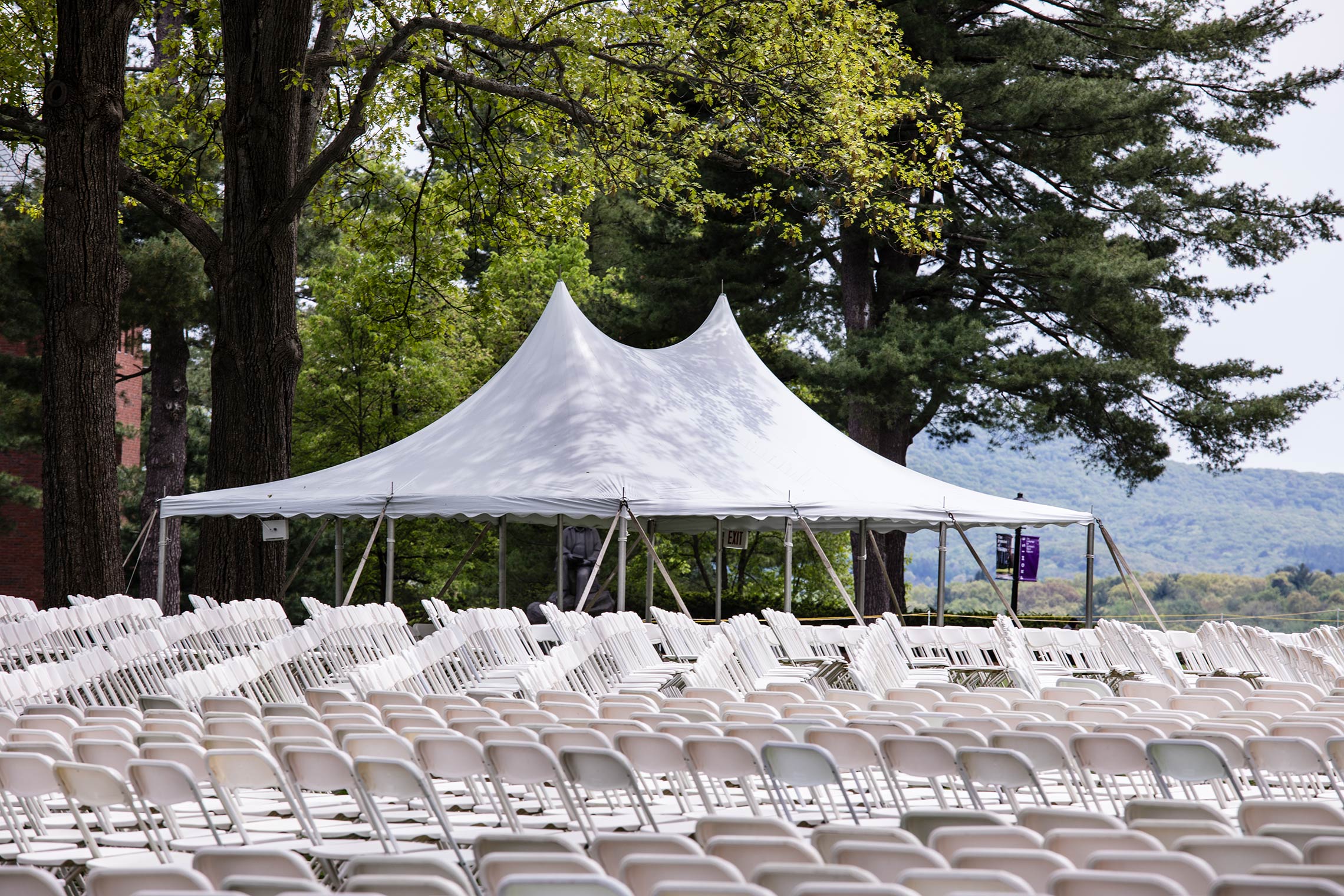 Commencement chairs begin set up on the Academic Quad