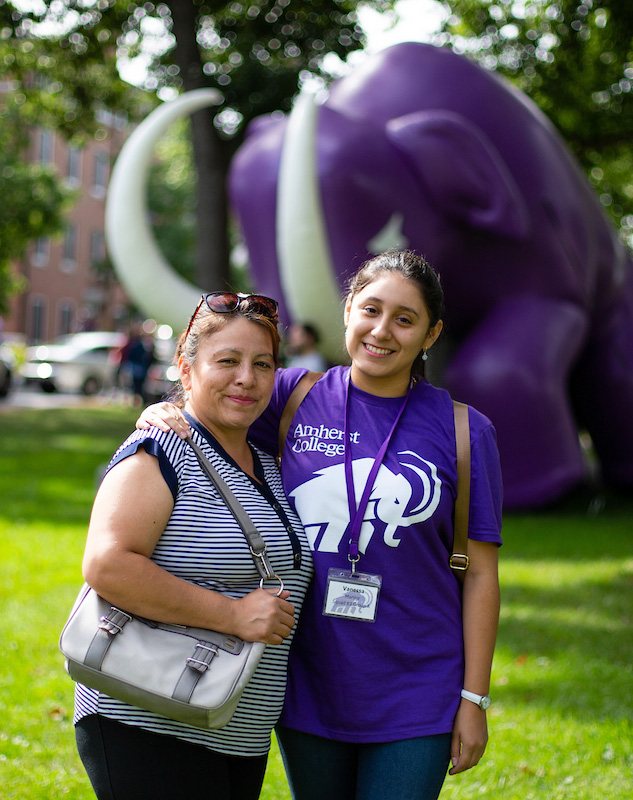 mother and daughter pose in front of the giant mammoth at orientation