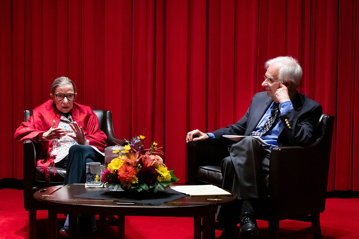 Justice Ruth Bader Ginsburg and Professor Austin Sarat sitting on a stage conversing
