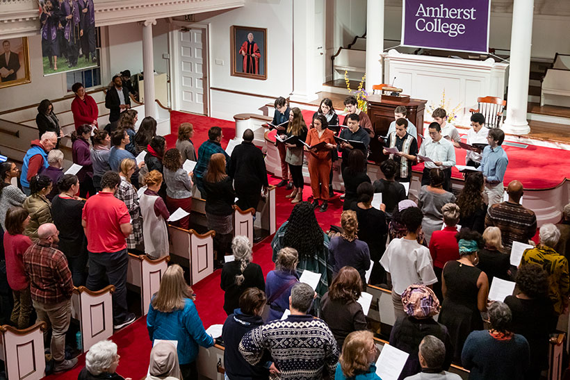 The Amherst Choral society performs to a crowd in Johnson Chapel