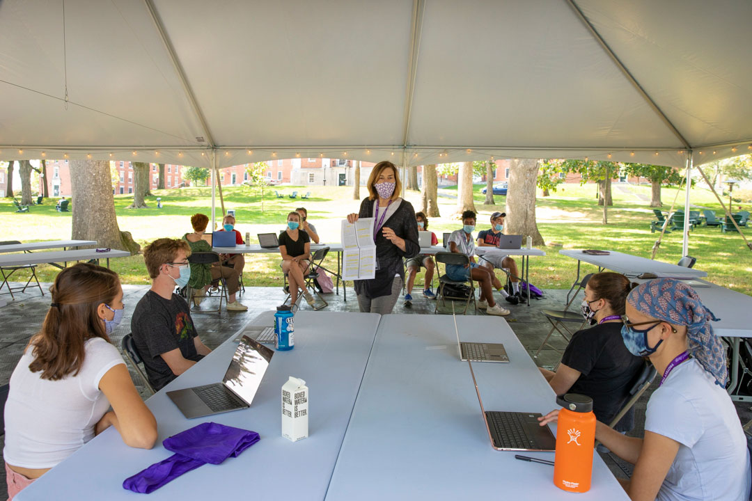 A professor teaching a class outside during the fall 2020 pandemic at Amherst College