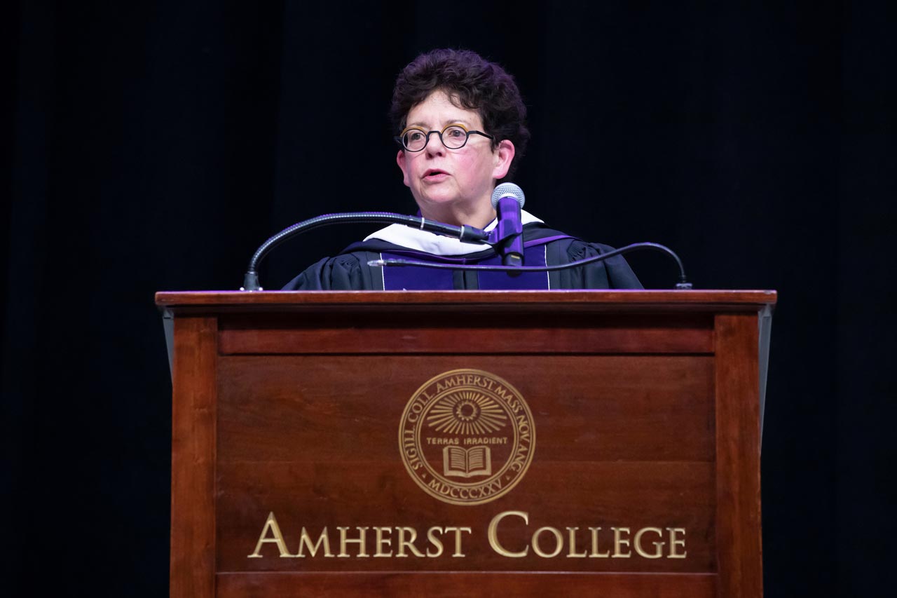 Biddy Martin at podium delivers commencement address