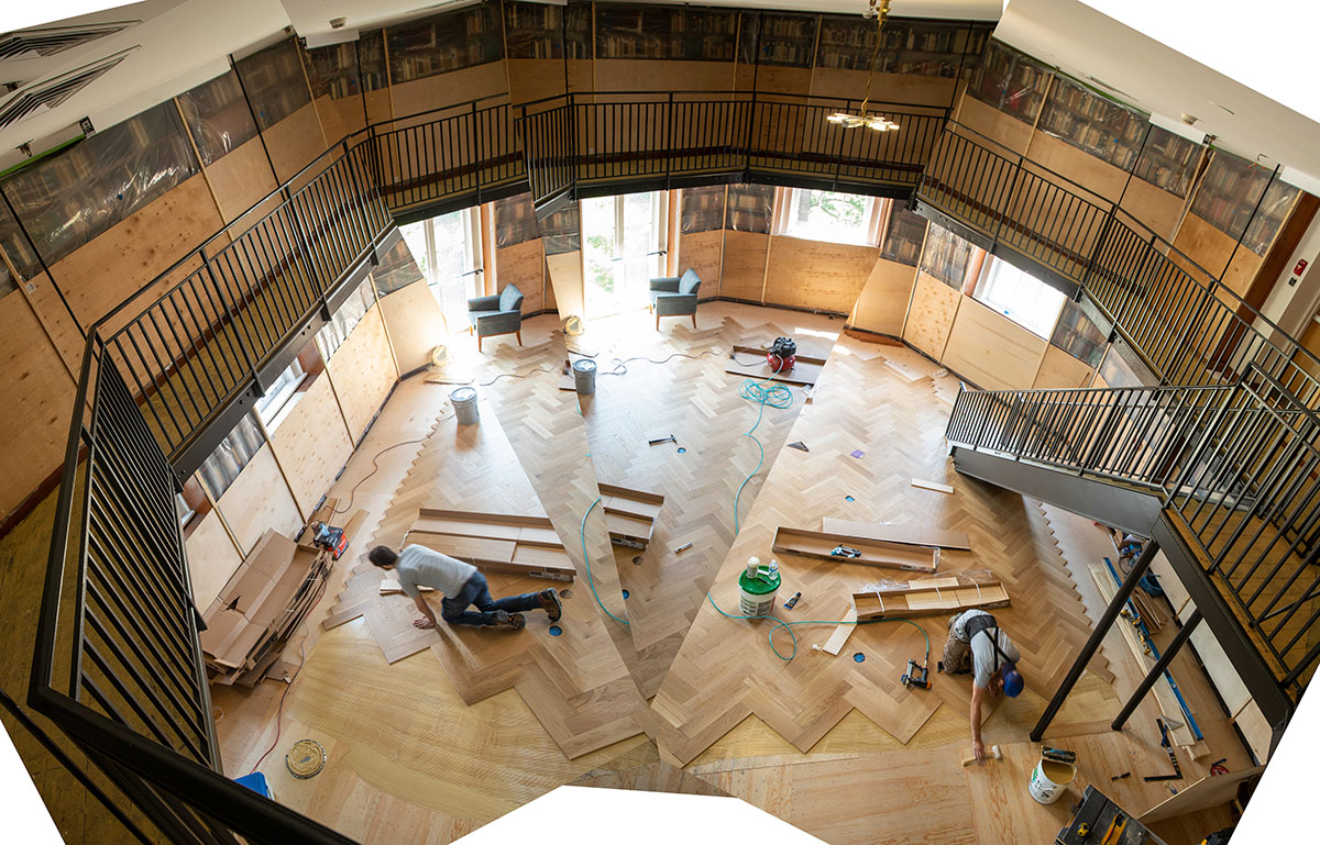 Workers replacing the wooden floor of the Russian Center