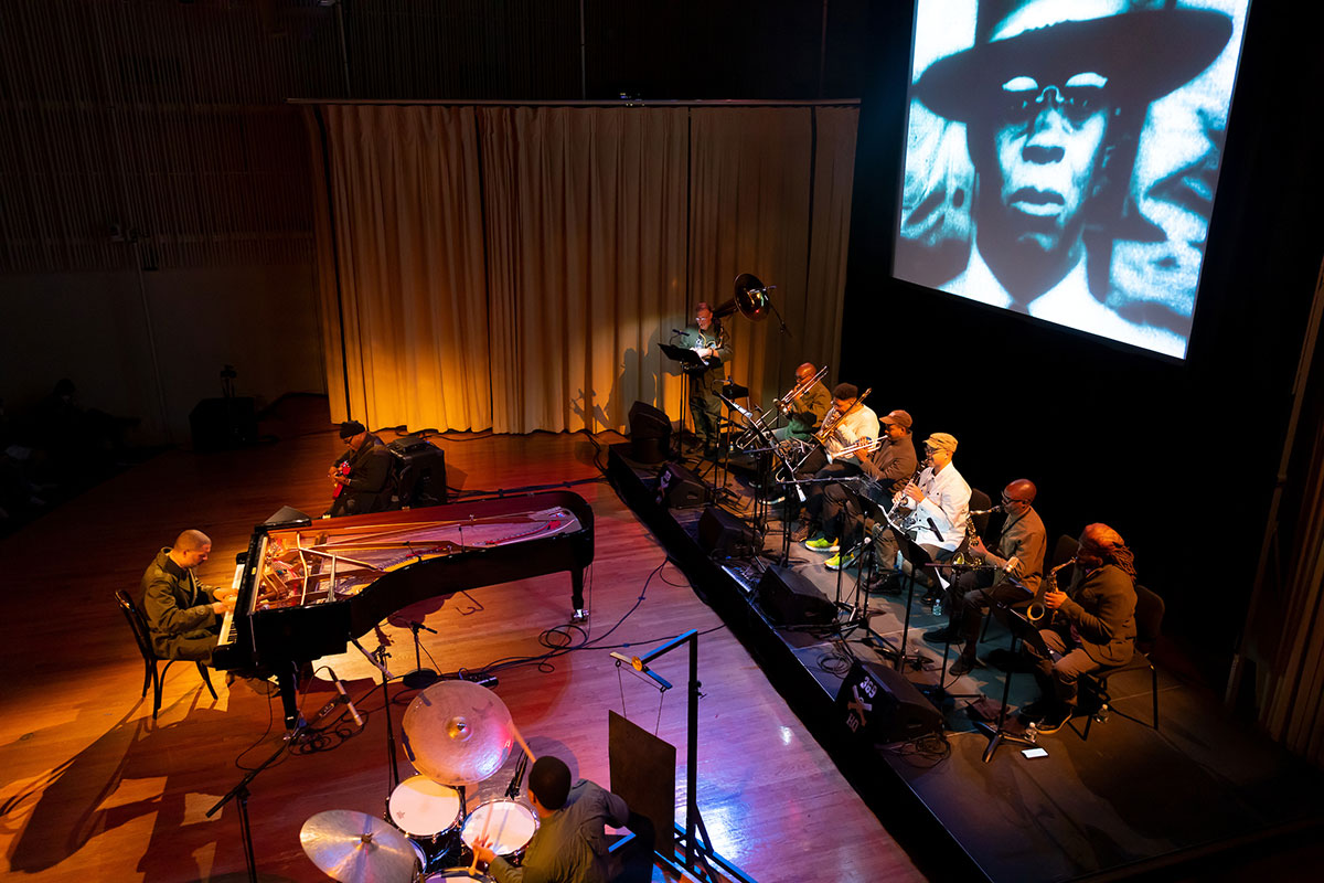 Jason Moran and the Harlem Hellfighters perform on stage.