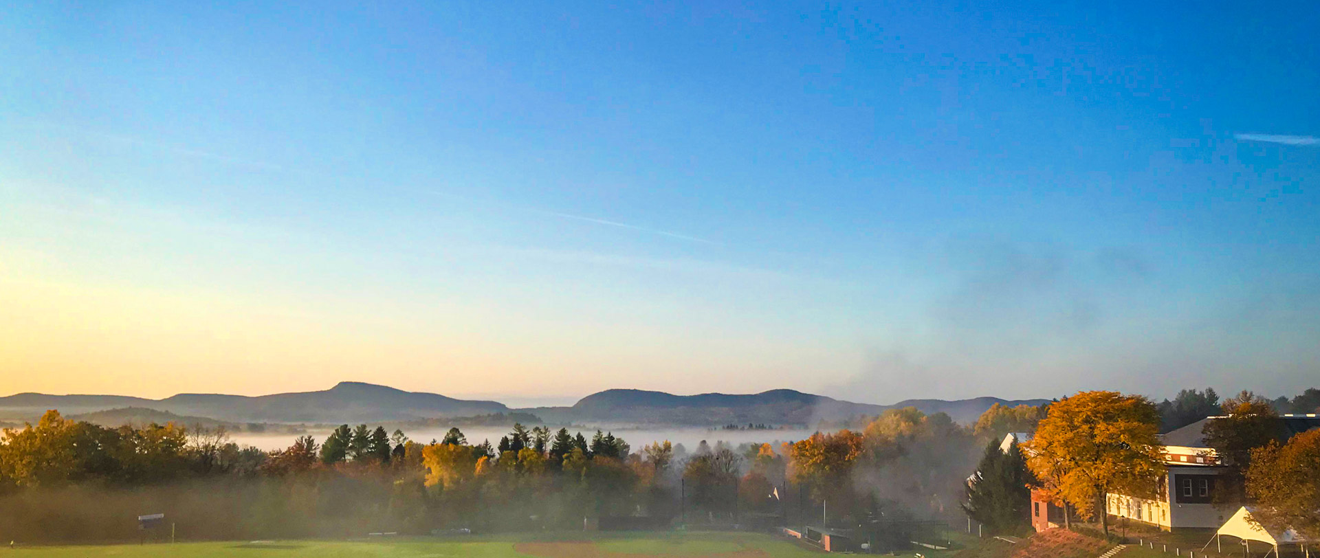 Holyoke Range in morning sunlight under a blue sky