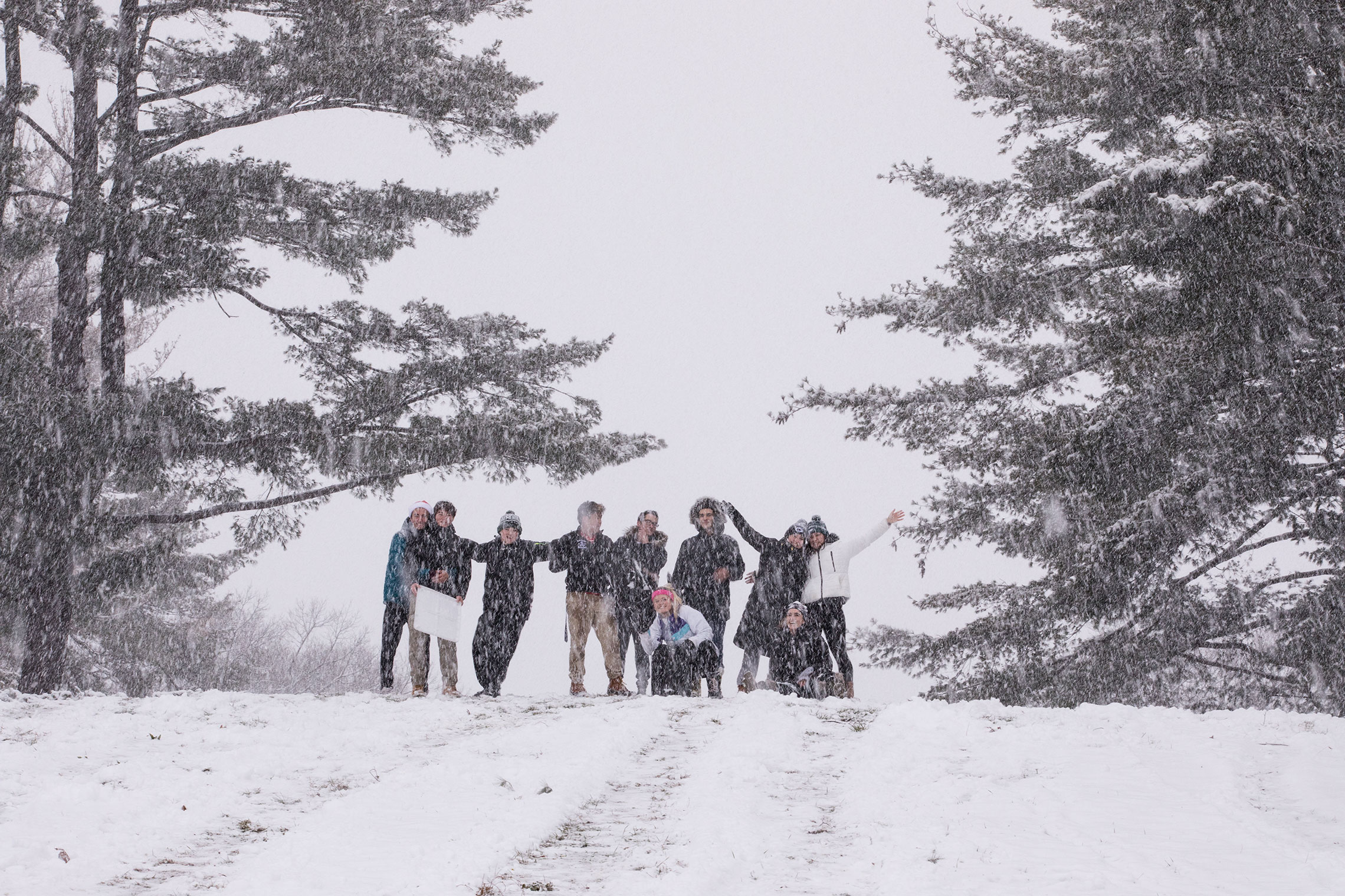 Students sledding on the Amherst College campus.