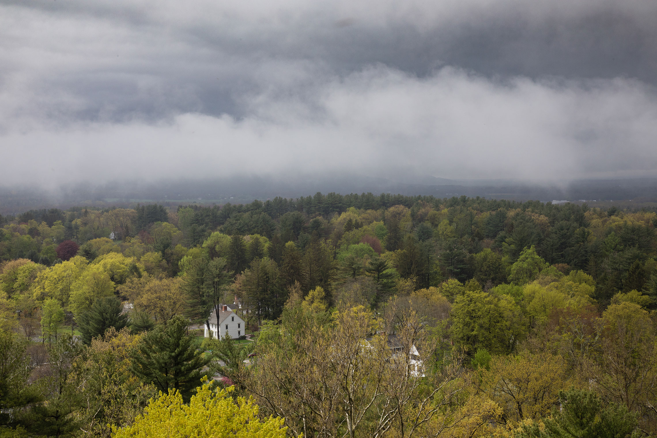 Aerial view of Amherst College under cloudy skies.