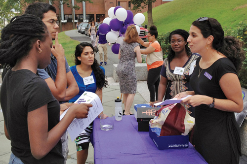 Outside Keefe Campus Center, Edith Cricien ’14 enrolls students in Pathways, a new mentoring program