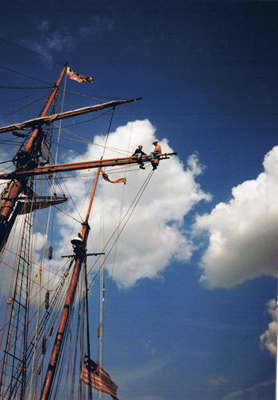 2 people on rigging of tall-ship