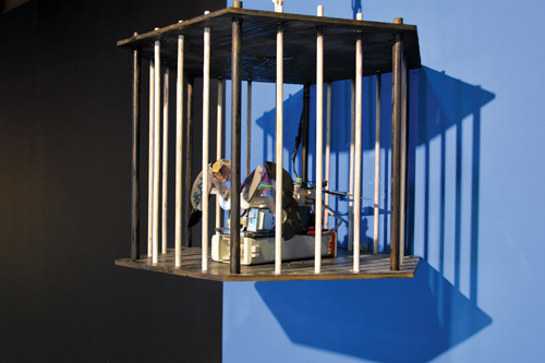 The “bird” inside the cage is made of printer parts, an egg beater, old CDs, an electrical transformer and a remote-controlled toy car.