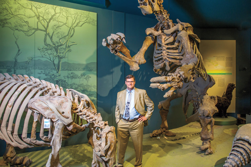Kirk Johnson ’82 among dinosaurs at Smithsonian Museum of Natural History