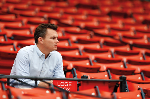 Mark Cherington sitting in empty stands at Fenway Park