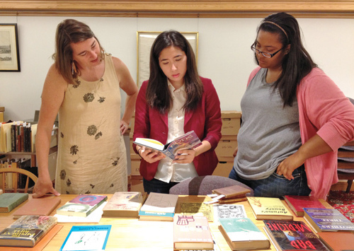 Danielle Trevino ’14 reviewing collection with Professor Brooks