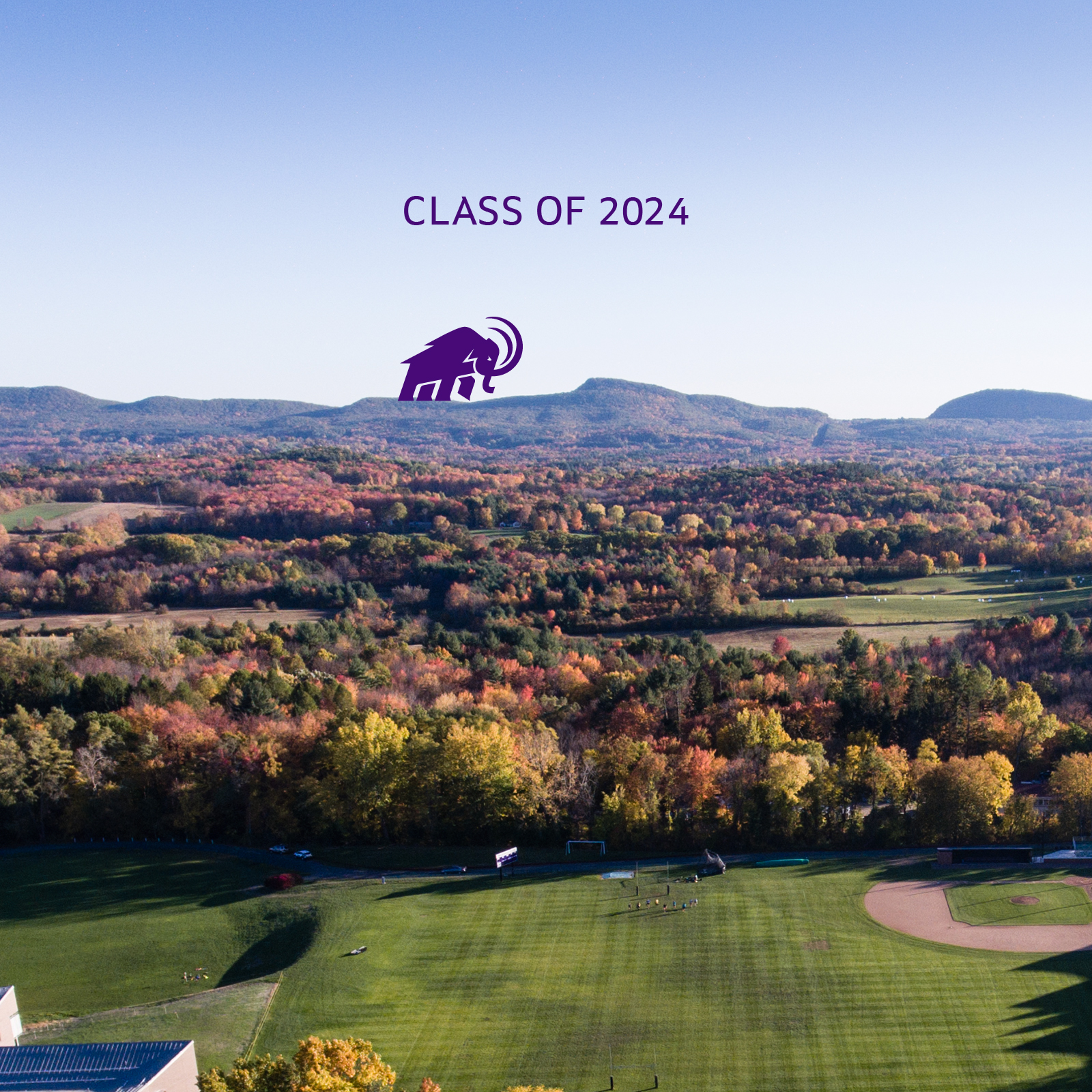 Class of 2024 on aerial photo of campus with mammoth walking on mountain range