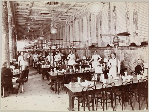 Black-and-white photo of a restaurant and its employees