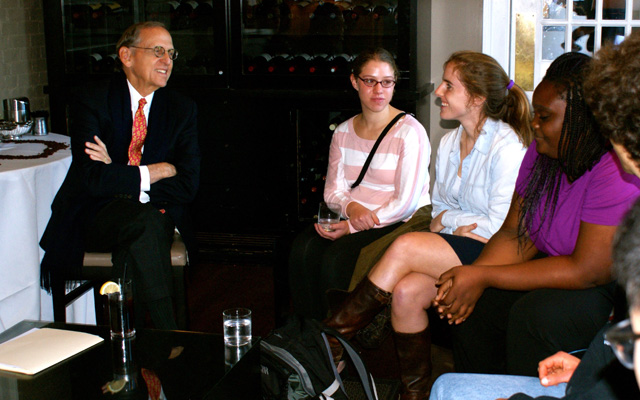 Chuck Lewis talks with students