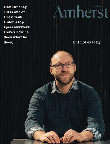 The cover of the spring 2021 Amherst Magazine showing a man against a dark background