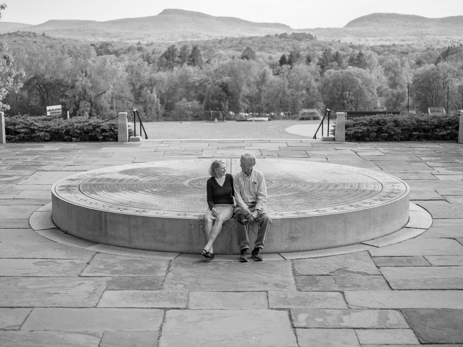 Chuck and Polly Longsworth sit on the War Memorial