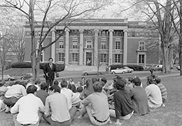 A black and white photo of a group of students outside Converse Hall
