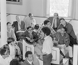 A young man speaking to students in Johnson Chapel