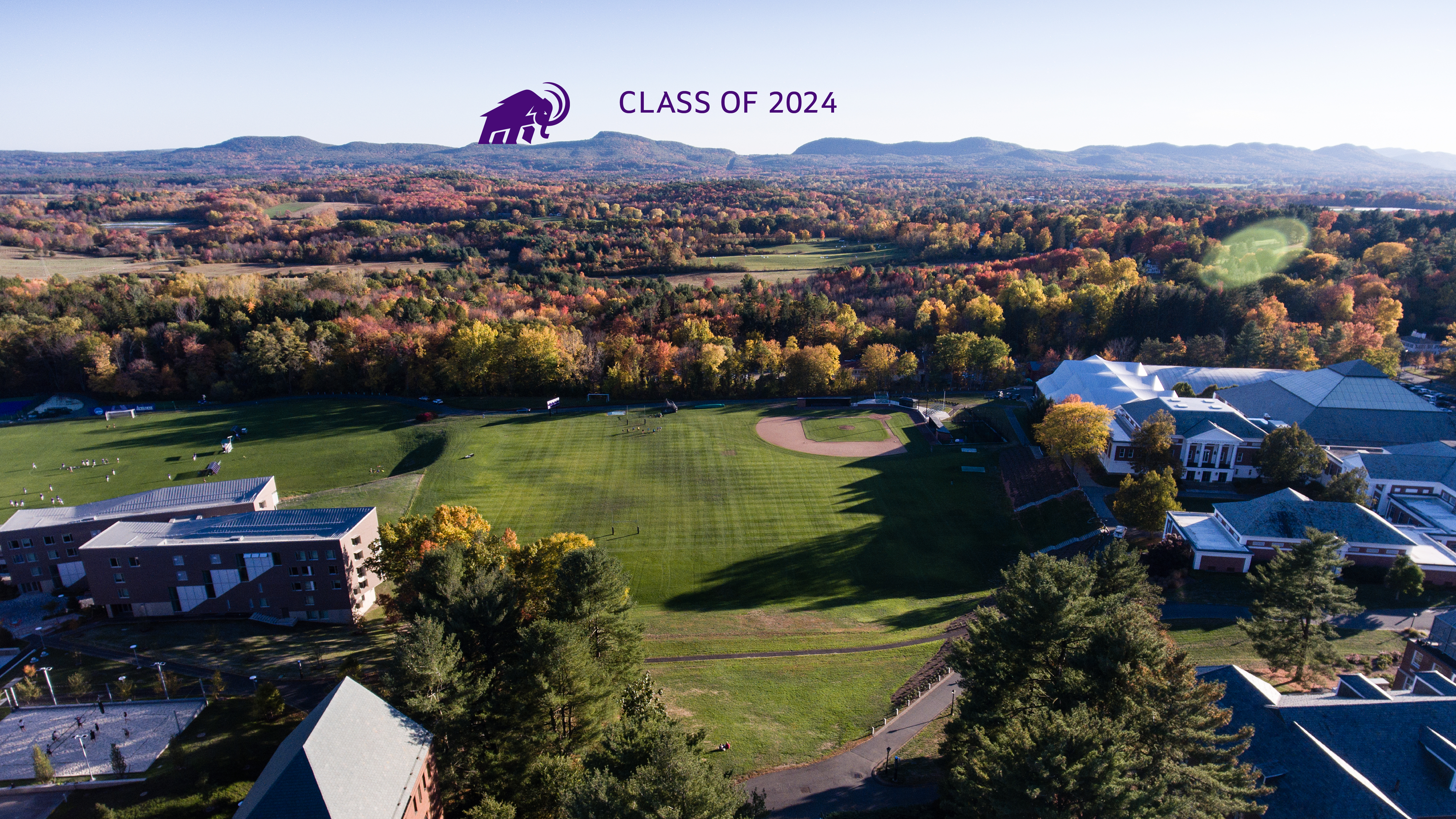 Class of 2024 on an aerial photo of campus with a mammoth walking on the range