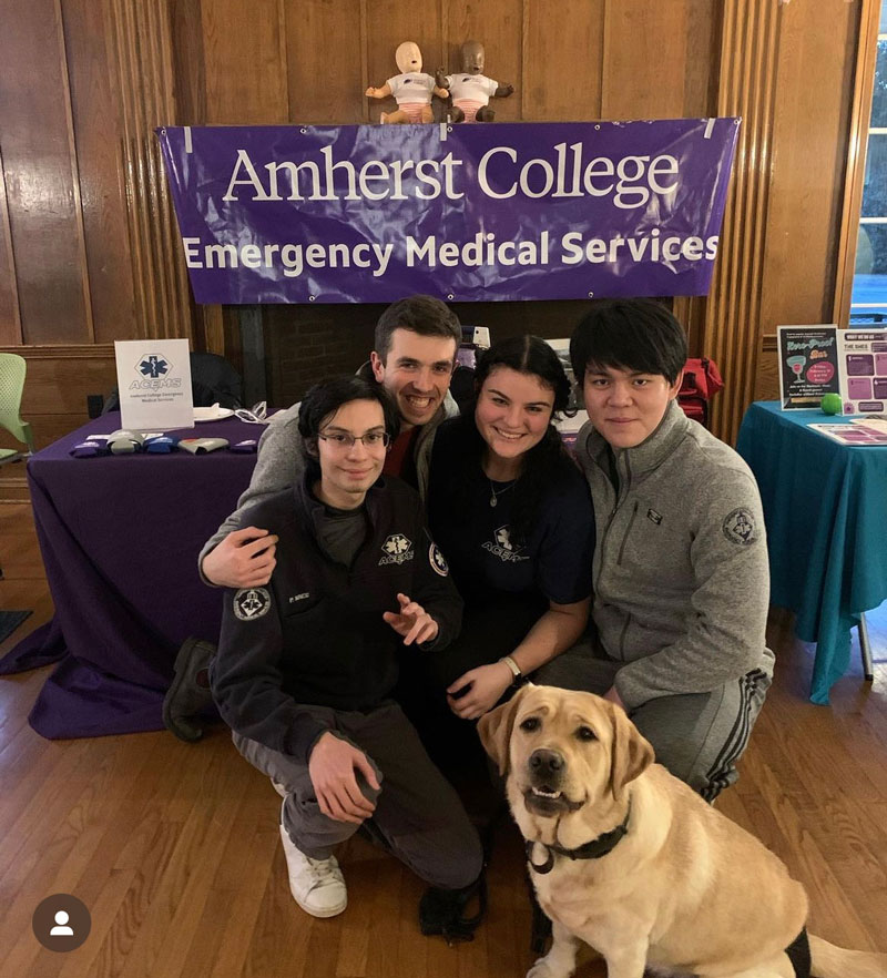Moose the comfort dog with the student medical response ACEMS team