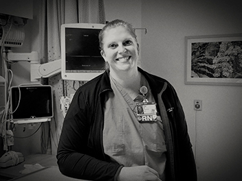 A black and white photo of a nurse in an operating room