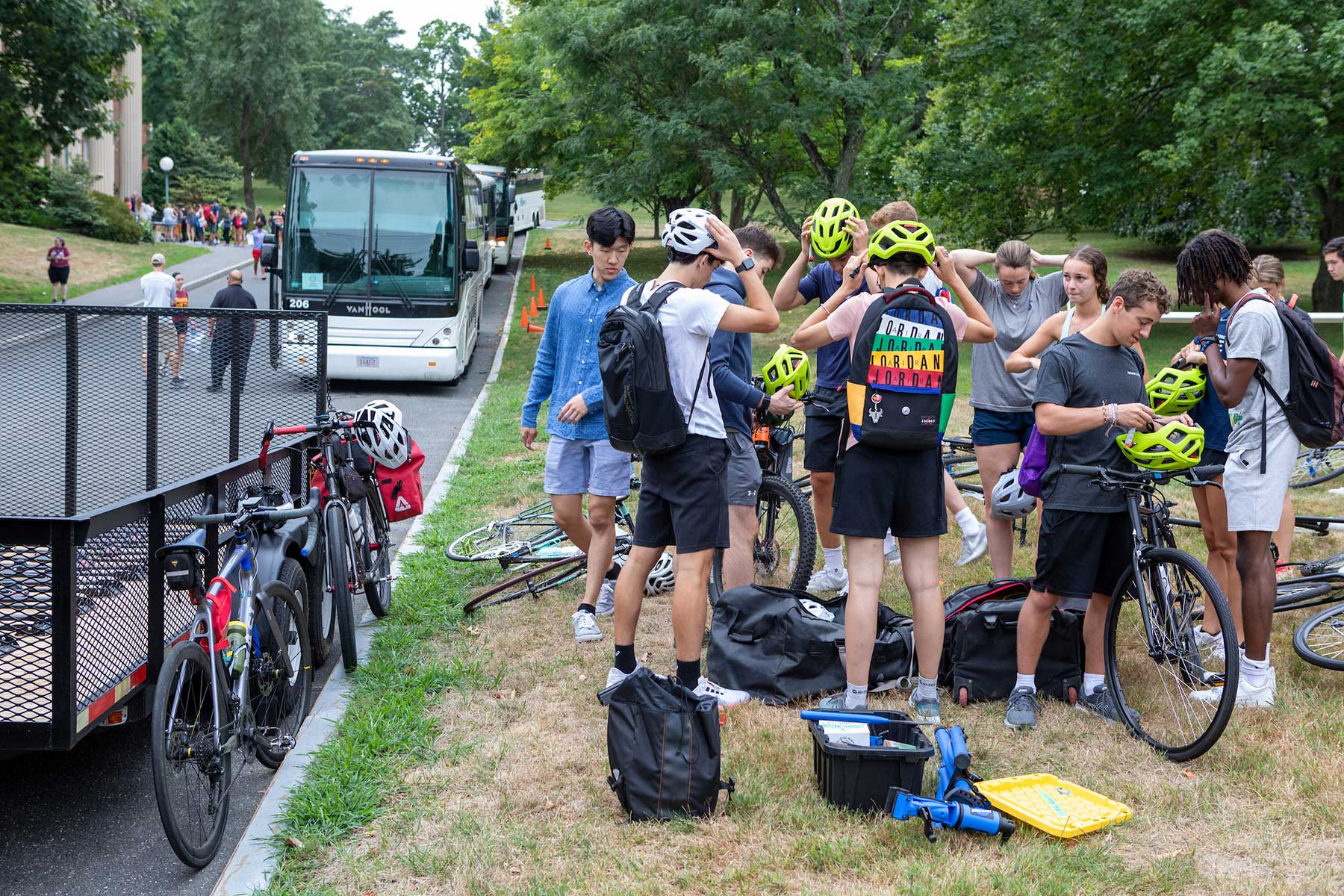 A group of students with bicycles prepares for a ride.