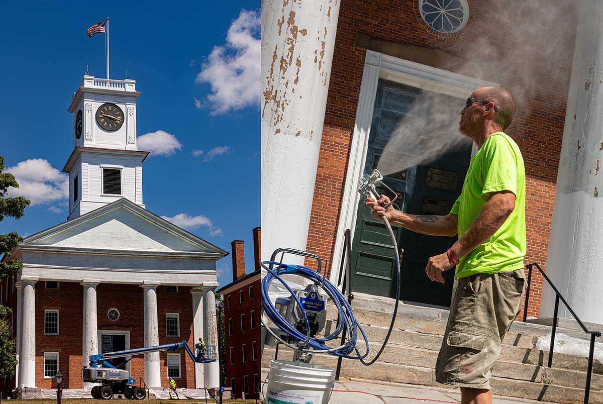 A worker cools himself with the spray from a hose during renovation work at Johnson Chapel