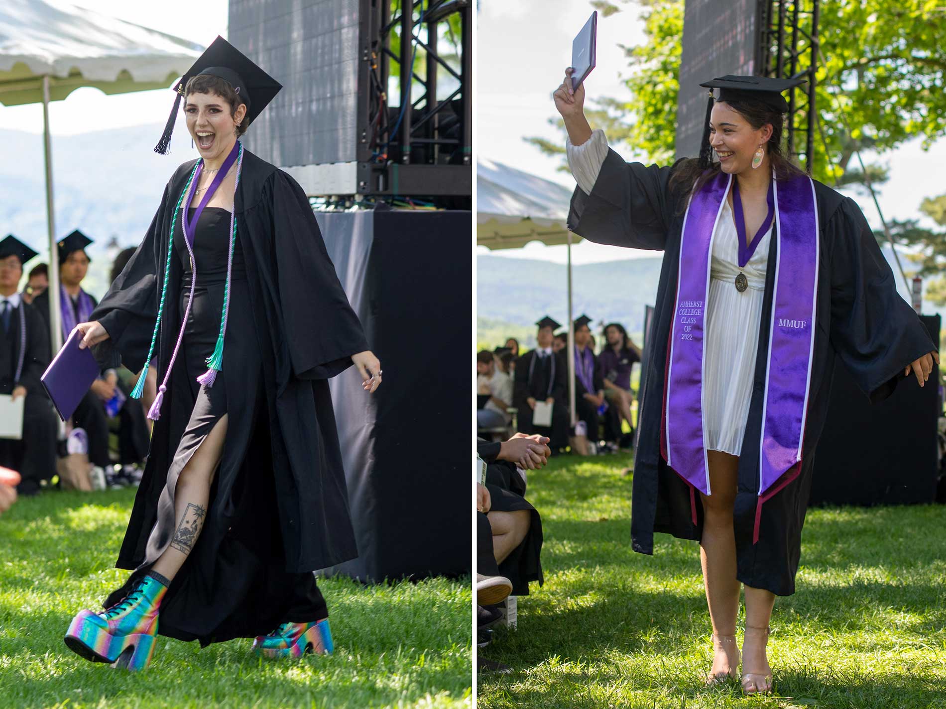 Two female graduates celebrate after receiving prizes.