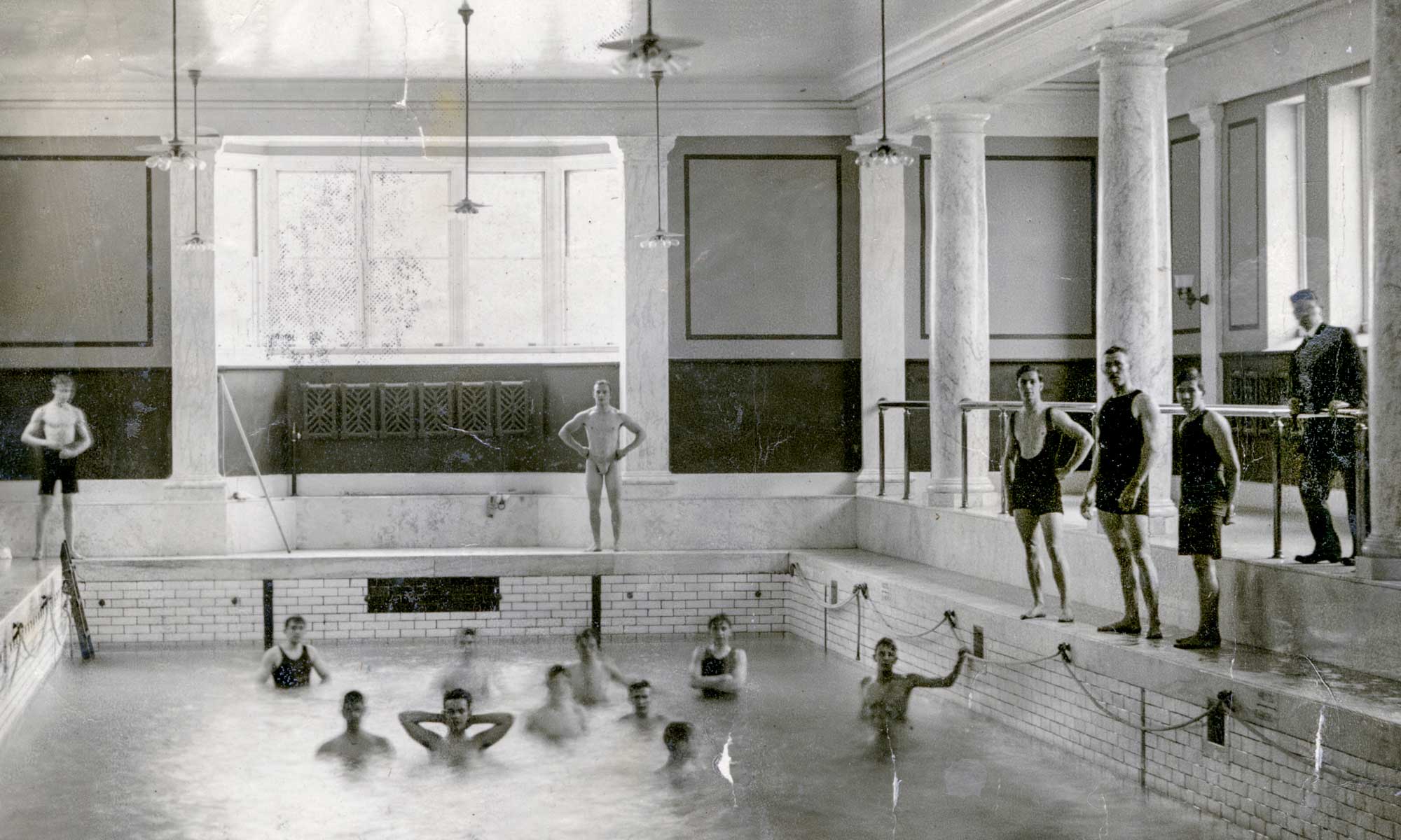 swimmers in an indoor pool