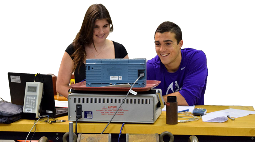 Two student working together in front of a computer.