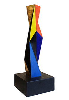 A modern sculpture of a many-sided multi-colored column