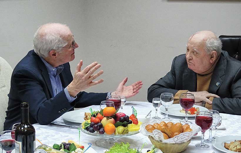 William Taubman and Mikhail Gorbachev sitting together for a meal