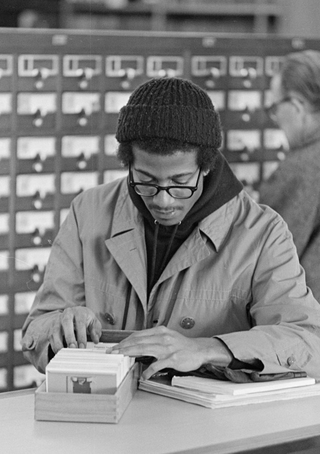 student using library in 1971