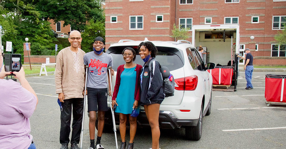 a family poses for a photo at move-in day