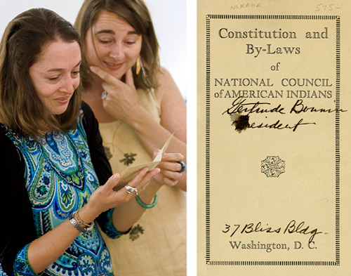 Professors Kiara Vigil and Lisa Brooks viewing 1926 handbook